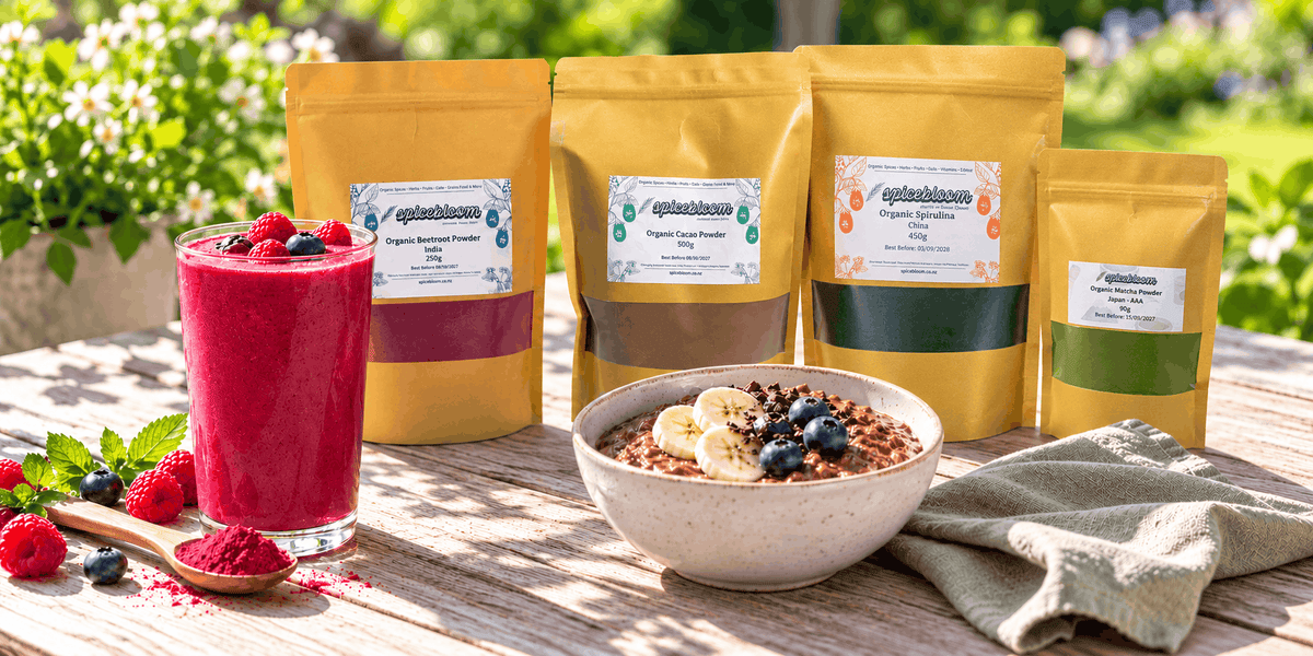 Outdoor breakfast with a berry smoothie, cacao bowl and SpiceBloom beetroot, cacao, organic spirulina and matcha packets.