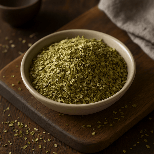 A close-up of SpiceBloom's Premium Greek Rubbed Natural Oregano, showcasing vibrant, whole dried leaf flakes packed with essential oils for authentic Mediterranean cooking.