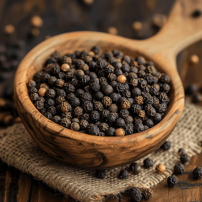 A close-up of SpiceBloom's premium whole black peppercorns from India, ready to be freshly ground for bold, aromatic flavour.